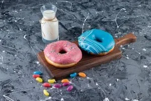 colorful-glazed-doughnuts-marble-table-scaled-qvlb6r0dhr08rndicyohurhdkg9or1mhnf4yjth1hs